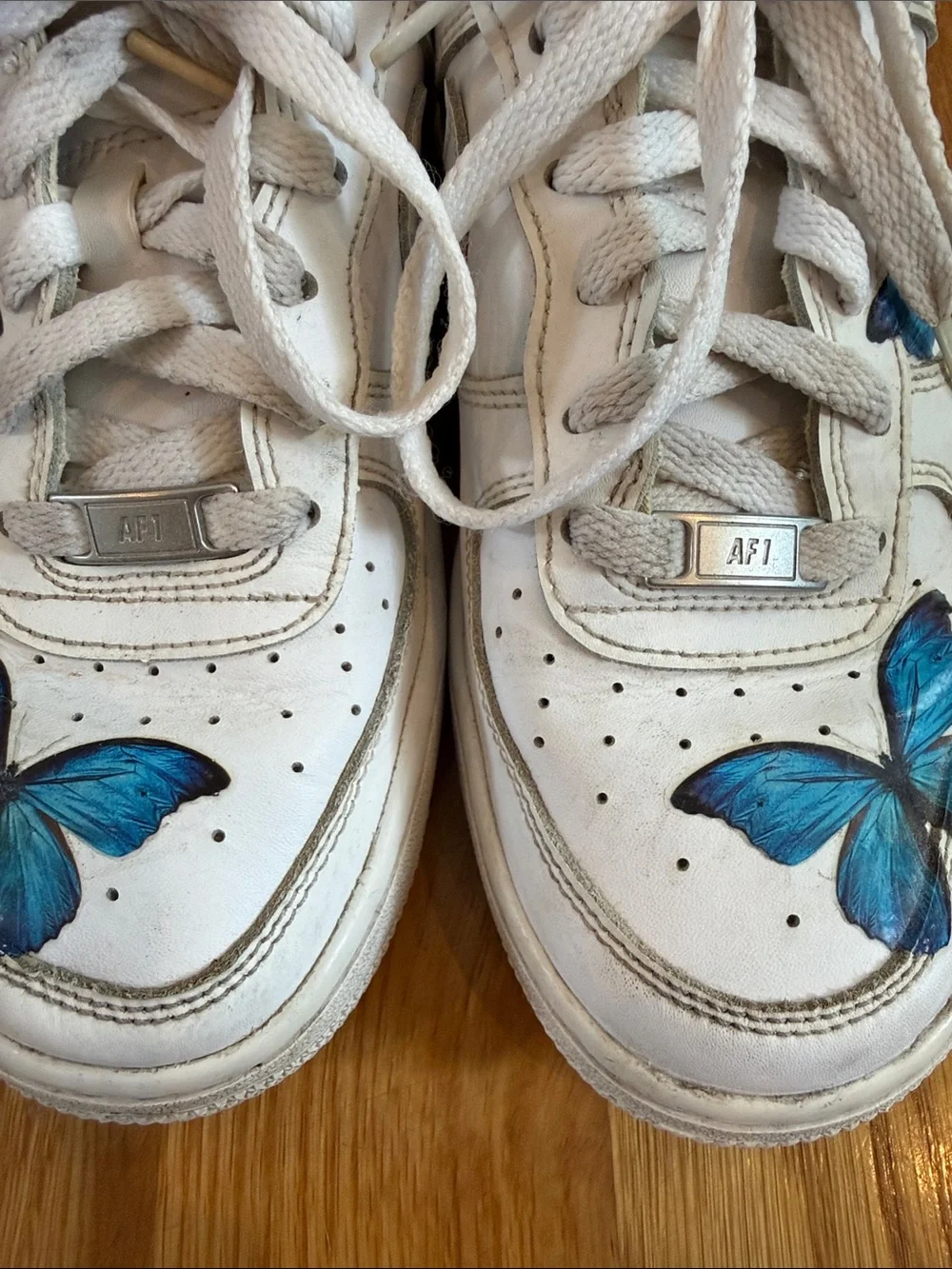 Nike Air Force One Sneakers with Blue Butterfly Accents